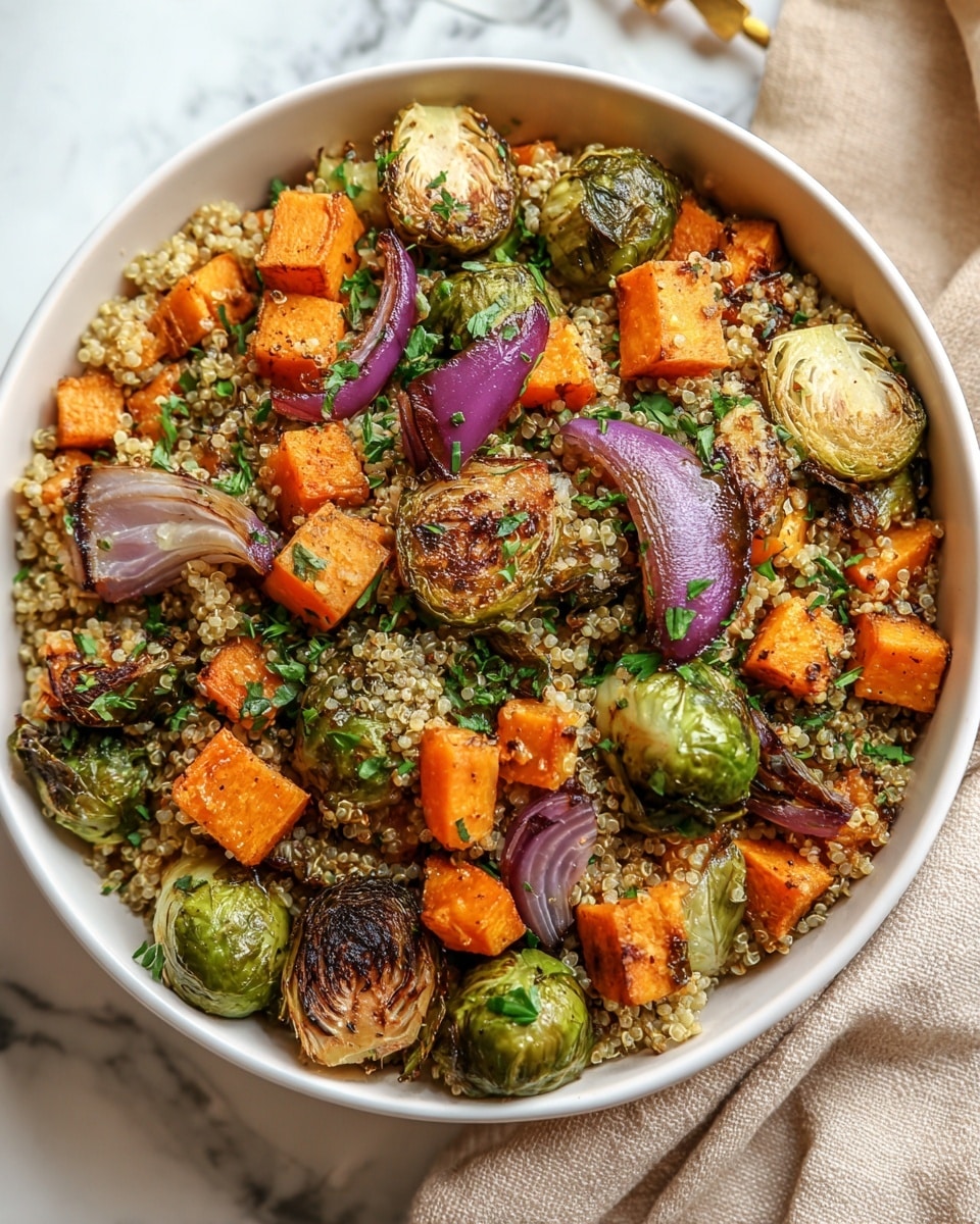 A white bowl filled with a quinoa base that is light brown and textured with small round grains, topped with roasted Brussels sprouts that are green with charred brown edges, medium-sized orange cubes of roasted sweet potato, and sliced red onions with purple and translucent layers, all mixed with chopped green herbs scattered evenly on top. The bowl sits on a white marbled surface with a soft beige cloth partially visible nearby, creating a cozy and fresh look. photo taken with an iphone --ar 4:5 --v 7